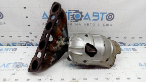 The exhaust manifold with a catalytic converter for a 2021 Nissan Rogue Sport is rusty, the studs are sawed off, and the bolts are broken.
