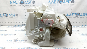 The bare heater housing of a 19-22 Nissan Rogue Sport without heated seats is broken.