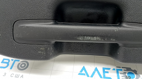 Lower tailgate trim for a Ford Edge 15-24, black, under the electric cover, scratches, scuffs, whitened plastic