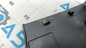 Upper center trunk door trim for Ford Edge 15-24 is black, the fastener is dented, the plastic is whitened