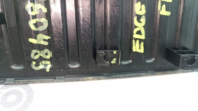 The driver's footrest for the Ford Edge 15-24 is black, the fasteners are broken, and it is worn.