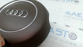 The steering wheel airbag for the driver's side of the Audi A6 C7 16-18 is brown and scratched.