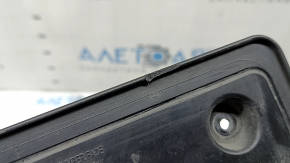 Honda CRV 20-22 front license plate area with scratches and cracks in the mountings