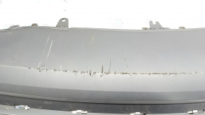 The rear bumper lip of the Audi A6 C7 16-18 restyling s-line is gray, scratches, cracked fasteners, broken fastener, chips
