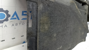 The rear left underbody protection of the Audi A6 C7 12-18 is pressed and worn.