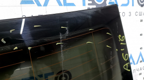 The rear window of an Audi A6 C7 12-18 has a broken heating wire, and is not factory tinted.