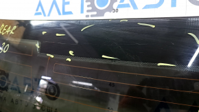 The rear window of an Audi A6 C7 12-18 has a broken heating wire, and is not factory tinted.