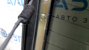 The rear window of an Audi A6 C7 12-18 has a broken heating wire, and is not factory tinted.