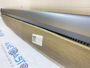 Tesla Model 3 18's upper dashboard trim panel - wood grain, veneer peeling off