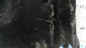 The front left underbody protection of the Audi A6 C7 12-18 is worn and torn.