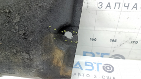 The front right underbody protection of the Audi A6 C7 12-18 is worn and torn.