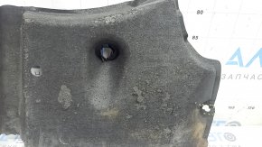 The front right underbody protection of the Audi A6 C7 12-18 is worn and torn.