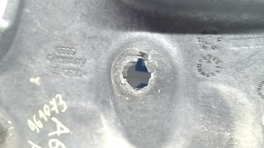 The front right underbody protection of the Audi A6 C7 12-18 is worn and torn.