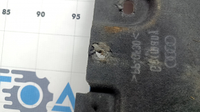 The left underbody protection of the Audi A6 C7 12-18 is torn and worn.