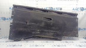 The right underbody protection of the Audi A6 C7 12-18 is worn and torn.