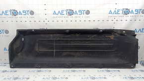 The right underbody protection of a Hyundai Tucson 22-26 is dented and the fastener is torn off.