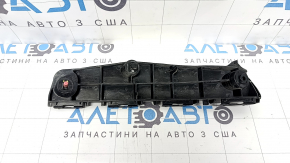 The right front bumper mount for a Toyota Prius 50 16-22 has a broken latch.