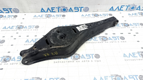 The lower control arm under the rear right spring of the VW Passat b7 12-15 USA is dented.