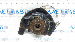 Front right axle hub for a Lexus ES300 ES330 with a cover and ABS sensor. The bearing is humming, the cover is dented, and it's rusty.