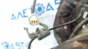 Front right axle hub for a Lexus ES300 ES330 with a cover and ABS sensor. The bearing is humming, the cover is dented, and it's rusty.