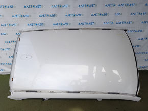 The metal roof of a Mazda CX-9 16-23 without a sunroof is sawn off, dented, and has bumps.
