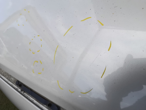 The metal roof of a Mazda CX-9 16-23 without a sunroof is sawn off, dented, and has bumps.