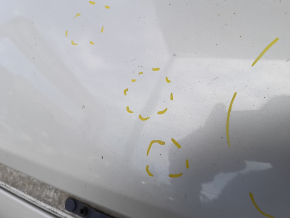 The metal roof of a Mazda CX-9 16-23 without a sunroof is sawn off, dented, and has bumps.