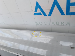 The metal roof of a Mazda CX-9 16-23 without a sunroof is sawn off, dented, and has bumps.