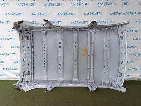 The metal roof of a Mazda CX-9 16-23 without a sunroof is sawn off, dented, and has bumps.