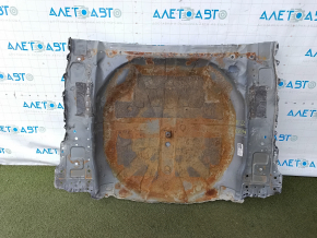The trunk trough of a Mitsubishi Outlander 22-26 is drilled out and dented.