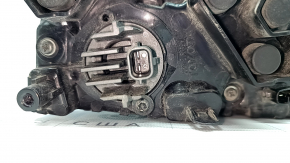 The right lower bumper light of a Toyota Prius 50 16-18 has dirty glass from the inside.