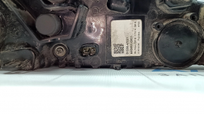 The right lower bumper light of a Toyota Prius 50 16-18 has dirty glass from the inside.