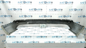 The bare lower rear bumper of a Volvo XC90 16-26 for parking sensors, white, the parking sensor mount is broken, dented, and there are cracks in the mounts.