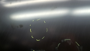 The bare hood of a VW Tiguan 18-24 steel is dented.