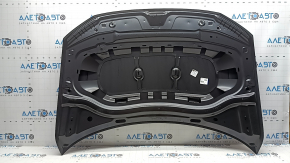 The bare hood of a VW Tiguan 18-24 steel is dented.