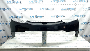 The rear bumper is bare and upper, Chevrolet Volt 16-19, black, with broken fasteners.