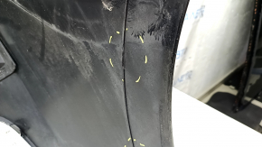 The rear bumper is bare and upper, Chevrolet Volt 16-19, black, with broken fasteners.