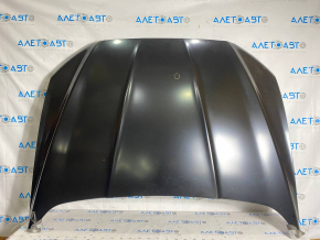 The hood of a Ford Fusion mk5 13-20 steel, China, is dented and dented.