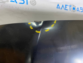 The hood of a Ford Fusion mk5 13-20 steel, China, is dented and dented.