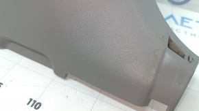 The lower right center pillar trim for a Toyota Prius V 15-17 is gray, worn, and the plastic has turned white.