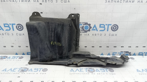 The left side engine protection of a Toyota Prius 50 16-18 is worn, torn, and dented.