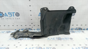 The left side engine protection of a Toyota Prius 50 16-18 is worn, torn, and dented.