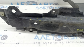 The left side engine protection of a Toyota Prius 50 16-18 is worn, torn, and dented.