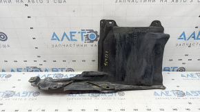 The right side engine protection of a Toyota Prius 50 16-18 is worn, torn, and dented.