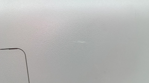 The lower trim of the trunk door of a Toyota Prius V 15-17 is gray, scratches, the plastic has turned white.