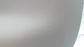 The lower trim of the trunk door of a Toyota Prius V 15-17 is gray, scratches, the plastic has turned white.