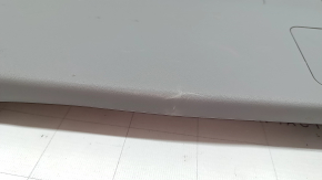 The lower trim of the trunk door of a Toyota Prius V 15-17 is gray, scratches, the plastic has turned white.