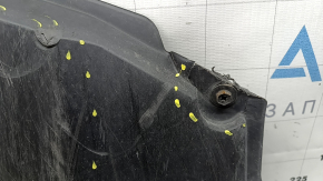 The front bumper guard of a Toyota Prius 50 16-18 is worn, torn, and dented.