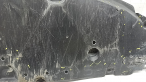 The front bumper guard of a Toyota Prius 50 16-18 is worn, torn, and dented.