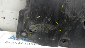 The front bumper guard of a Toyota Prius 50 16-18 is worn, torn, and dented.